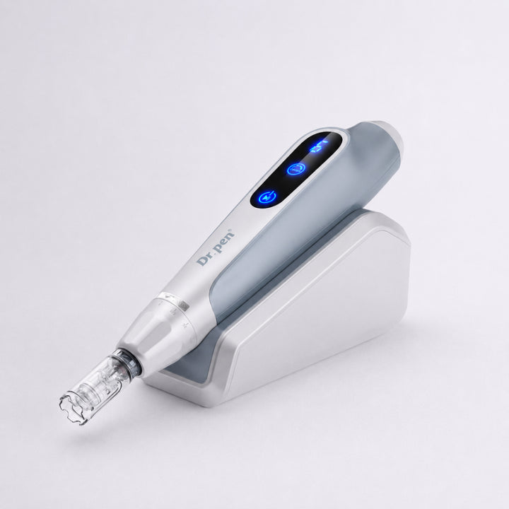 Dr. Pen MC9 Ultima PRO Microneedling Pen device with digital display switched on, placed on its charging base on a white background